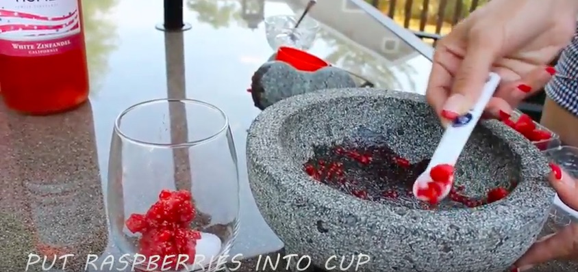 Put raspberries into wine cocktail