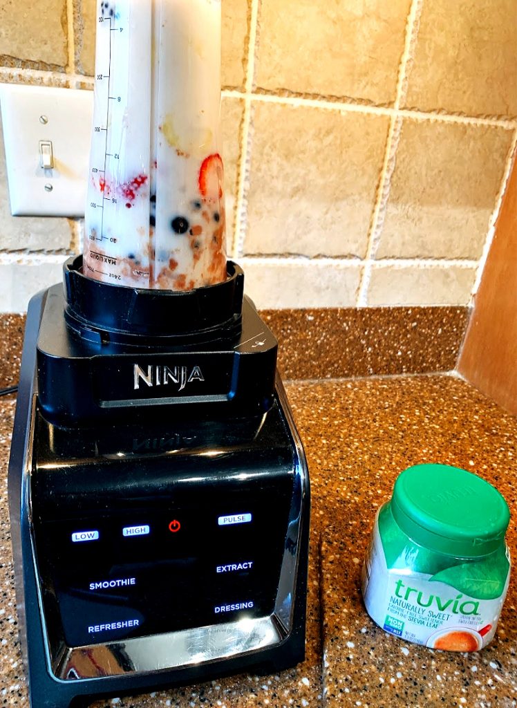 mixing up a banana berry smoothie