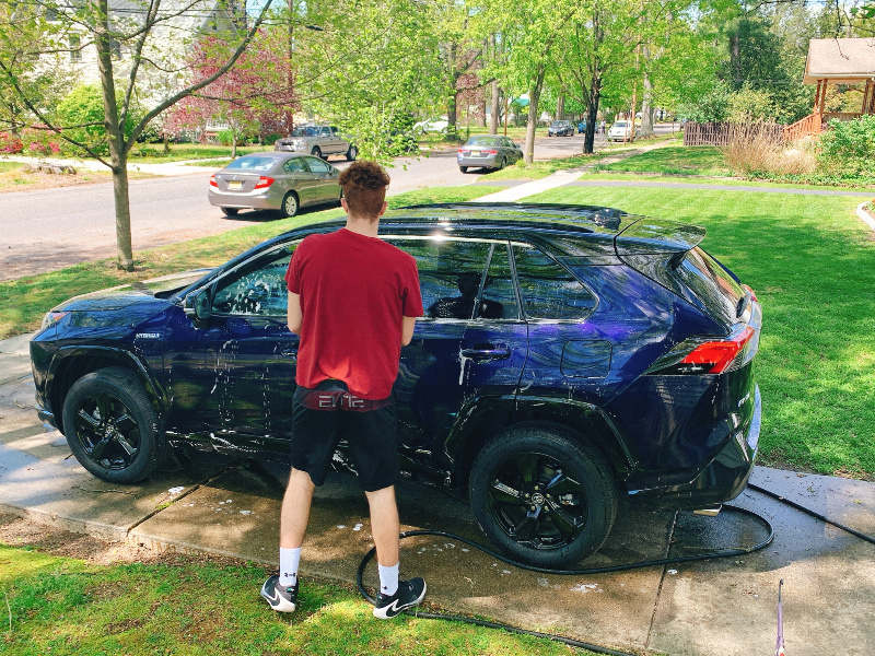teen washing Toyota Hybrid Rav4