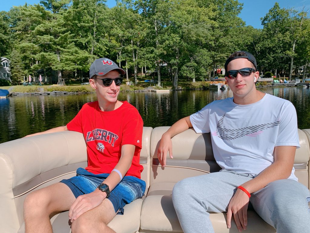 boys chilling on boat ride