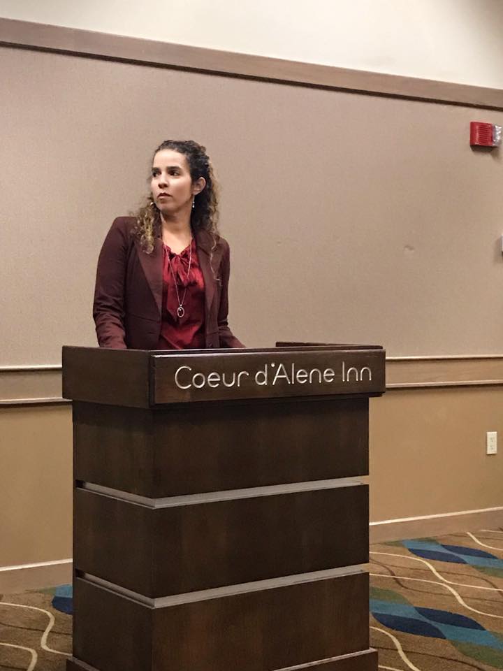 Latina speaking at conference